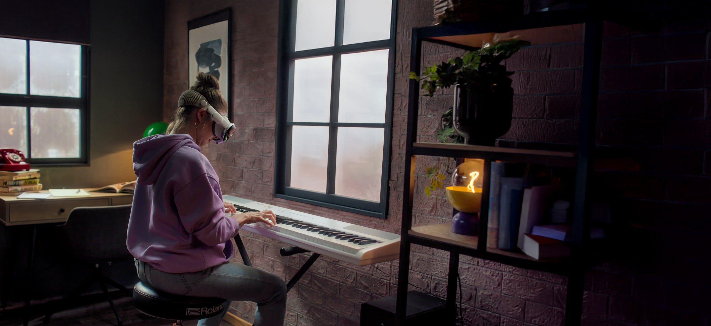 A woman playing the piano using vr headset